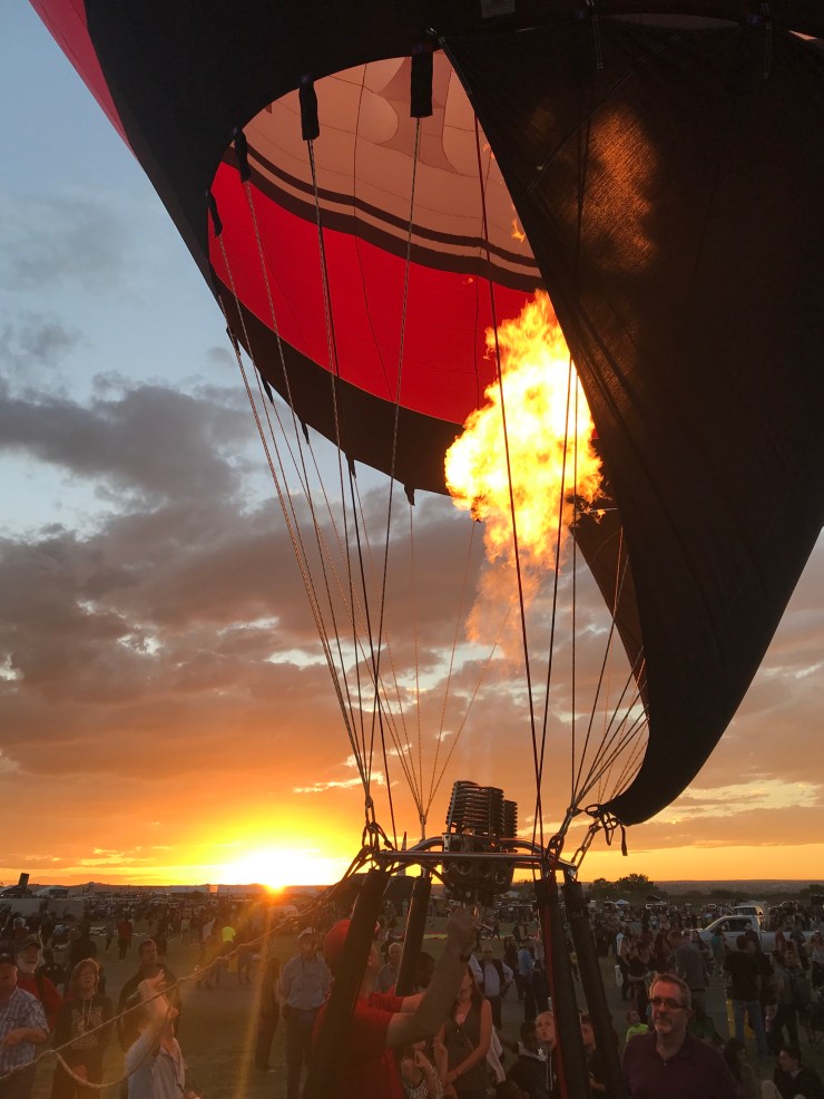 Blowing up one of the balloons at dusk before the Glodeo